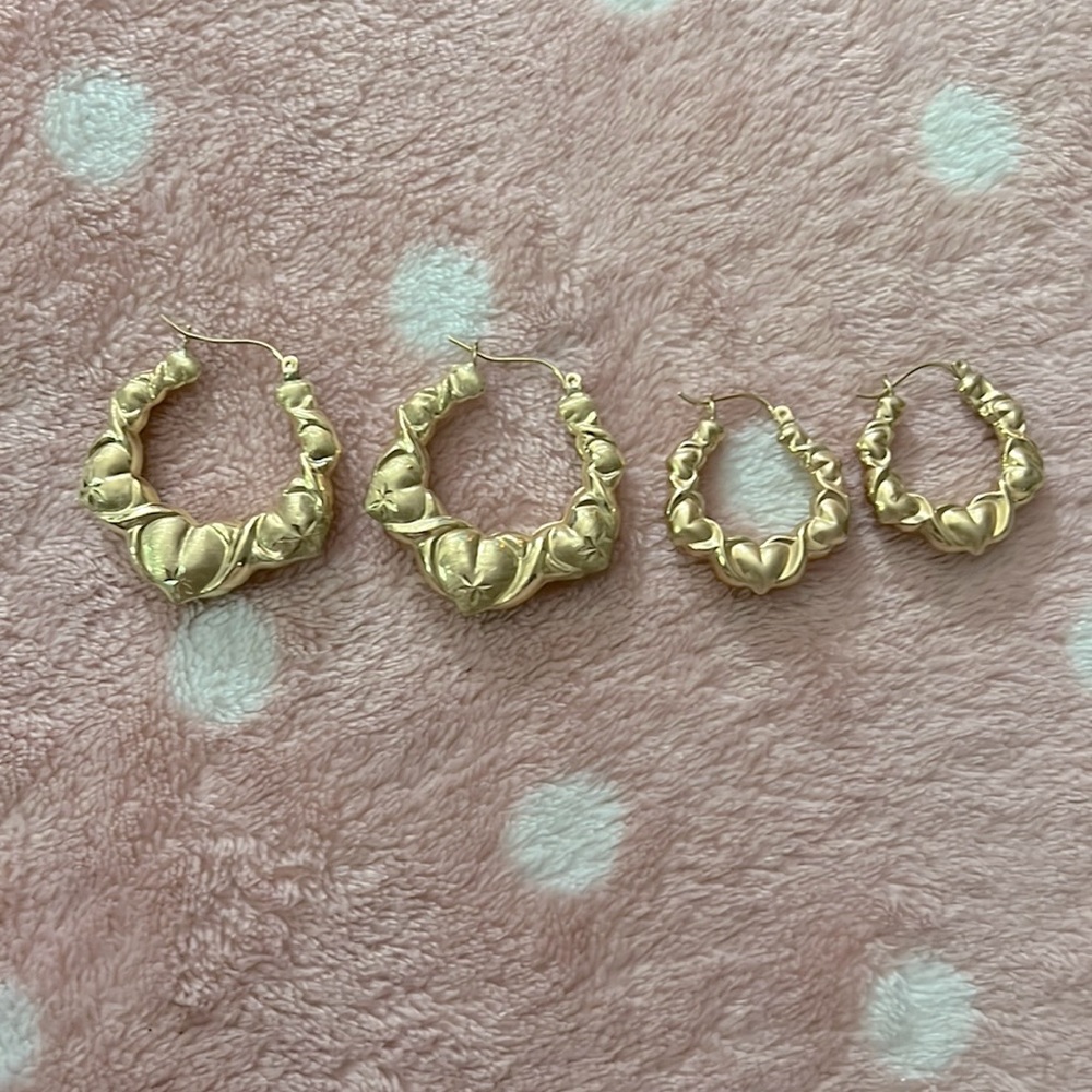 There's two pairs of X heart hoop earrings. Great condition-used-both 10k gold-